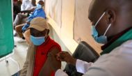 A healthcare professional administers a dose of AstraZeneca (COVID-19) vaccine at the Narok County Referral Hospital, in Narok, Kenya, December 1, 2021. REUTERS/Baz Ratner/File Photo

