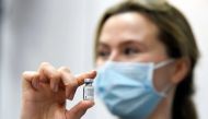 Lotte Soeteman, advisor of Netherland's Health Minister Hugo De Jonge, holds the first used Pfizer/BioNTech COVID-19 vaccine in the last EU country to start vaccinations against the coronavirus disease (COVID-19) is pictured in Veghel, Netherlands, January 6, 2021. REUTERS/Piroschka van de Wouw

