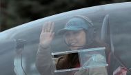 FILE PHOTO: Belgian-British pilot Zara Rutherford, 19, waves as she departs for a round-the-world trip in a light aircraft, aiming to become the youngest female pilot to circle the planet alone, in Wevelgem, Belgium, August 18, 2021. REUTERS/Yves Herman/File Photo

