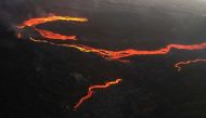 An aerial view of the lava from the Cumbre Vieja volcano near Tacande neighborhood, on the Canary Island of La Palma, Spain, December 13, 2021. Picture taken with a drone. REUTERS/Borja Suarez