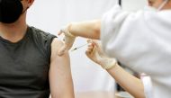 FILE PHOTO: A medic administers a booster dose of the Moderna COVID-19 vaccine, Spikevax, against the coronavirus disease at a vaccination centre in Berlin, Germany, January 1, 2022. REUTERS/Michele Tantussi/File Photo

