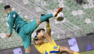Action during the Round 13 match between Al Gharafa and Al Ahli, yesterday.