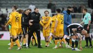 Cambridge United coach Mark Bonner celebrates with players after the match Action Images via Reuters/Lee Smith
