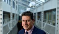 Ireland's Minister for Transport, Climate, Environment and Communications Eamon Ryan poses for a photograph after an interview with Reuters in his office, ahead of his trip to COP26, in Dublin, Ireland, October 28, 2021. REUTERS/Clodagh Kilcoyne/File Photo