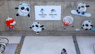 A worker walks outside the Main Press Centre ahead of the Beijing 2022 Winter Olympics in Beijing, China January 12, 2022. Reuters/Fabrizio Bensch
