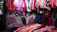 A shopkeeper waits for customers at a traditional market in Seoul, South Korea, January 14, 2022. REUTERS/Kim Hong-Ji