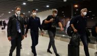 Serbian tennis player Novak Djokovic walks in Melbourne Airport before boarding a flight, after the Federal Court upheld a government decision to cancel his visa to play in the Australian Open, in Melbourne, Australia, January 16, 2022. REUTERS/Loren Elliott

