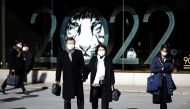People wearing protective masks, amid the coronavirus disease (COVID-19) outbreak, stand in front of a show window of a department store at a shopping district in Tokyo, Japan, January 18, 2022. 2022 is the Chinese Lunar New Year of the Tiger. REUTERS/Kim Kyung-Hoon
