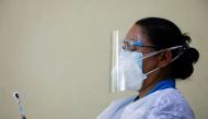 A healthcare worker draws a dose of the Johnson & Johnson vaccine against the coronavirus disease (COVID-19) into a syringe at Nepal Disabled Association Khagendra New Life Centre in Kathmandu, Nepal, July 19, 2021. REUTERS/Navesh Chitrakar



