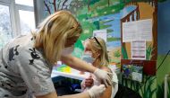 A nurse gives a dose of the Pfizer-BioNTech vaccine to a patient at the Bethesda Children's Hospital as the spread of the coronavirus disease (COVID-19) continues, in Budapest, Hungary, November 23, 2021. REUTERS/Bernadett Szabo/File Photo