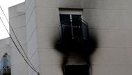 A member of the emergency services works at the scene where a fire ripped through a retirement home in Moncada, Spain, January 19, 2022. REUTERS/Eva Manez