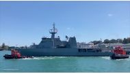 HMNZS Wellington departs with naval divers, hydrographers and a helicopter on board to assist with delivering supplies to Tonga after a volcanic eruption and tsunami, from Devonport Naval Base in Auckland, New Zealand January 18, 2022 according to a statement by New Zealand Defence Force. Courtesy of NZDF/Handout via REUTERS