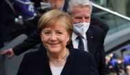 FILE PHOTO: Germany's outgoing Chancellor Angela Merkel arrives for a session of the German lower house of parliament Bundestag to elect a new chancellor, in Berlin, Germany, December 8, 2021. REUTERS/Annegret Hilse/File Photo
