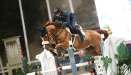 Saeed Nasser Al Qadi guides Electra B over a fence