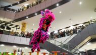 Lion dancers perform at Aeon Mall Sen Sok in Phnom Penh, Cambodia, January 30, 2022. Reuters/Cindy Liu
 