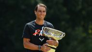 January 31, 2022 Spain's Rafael Nadal poses with the Norman Brookes Challenge Cup trophy after winning the Australian Open Joel Carrett/AAP Image via REUTERS