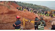 People use machinery to excavate the ground in order to free a boy trapped in an underground well, in Chefchaouen, Morocco, February 4, 2022, in this screen grab obtained from a social media video. AL3OMK.COM/via REUTERS