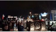 Supporters wave flags and cheer as truck and car drivers, part of a 'Freedom Convoy' on its way to Paris, arrive in Lyon, France February 10, 2022 in this still image taken from a video obtained from a social media. Video taken February 10, 2022. Gabriel Bonnaveira/via REUTERS 
