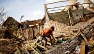 A man works on the destroyed house of Philibert Jean Claude Razananoro, in the aftermath of Cyclone Batsirai, in the town of Mananjary, Madagascar, February 8, 2022. REUTERS/Alkis Konstantinidis/File Photo
