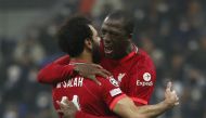 Mohamed Salah celebrates with team-mate Ibrahima Konate after scoring Liverpool’s second goal against Inter Milan, yesterday.