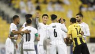 Al Sadd players celebrate after win over Qatar SC in their QSL match yesterday. Al Sadd won the match 1-0 at the Suhaim Bin Hamad Stadium.  PIC: Hussein Sayed 