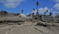 A general view shows damaged buildings and landscape covered with ash following the volcanic eruption and tsunami in Kanokupolu, Tonga, January 23,2022. Picture taken January 23, 2022. Tonga Red Cross Society/Handout via REUTERS 