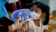 A child receives a vaccine against the coronavirus disease (COVID-19) at a health center as Cambodia begins to vaccinate children aged 3 to 5 years old, in Phnom Penh, Cambodia, February 23, 2022. REUTERS/Cindy Liu