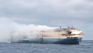 FILE PHOTO: The ship, Felicity Ace, which was traveling from Emden, Germany, where Volkswagen has a factory, to Davisville, in the U.S. state of Rhode Island, burns more than 100 km from the Azores islands, Portugal, February 18, 2022. Portuguese Navy (Marinha Portuguesa)/Handout via REUTERS THIS IMAGE HAS BEEN SUPPLIED BY A THIRD PARTY./File Photo
