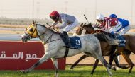 Jockey Faleh Bughanaim guides Al Shaqab Racing’s Algrain towards the finish line to win the Ain Khaled Cup at Al Uqda Racecourse.