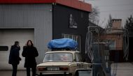Local residents are seen refueling at gas station after Russian President Vladimir Putin authorized a military operation in eastern Ukraine, in Mariupol, February 24, 2022. REUTERS/Carlos Barria/File Photo
