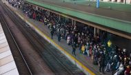 People wait to board an evacuation train from Kyiv to Lviv at Kyiv central train station, Ukraine, February 25, 2022. Picture taken through a window REUTERS/Umit Bektas