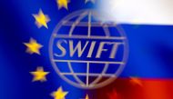 Swift logo is pictured with EU and Russian flags in this illustration picture taken February 26, 2022. Reuters/Dado Ruvic/Illustration