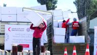 QRCS representatives delivering winterisation aid to IDPs in Syria.