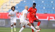 Al Duhail's Michael Olunga (right) in action against Umm Salal's Aymen Abdennour yesterday.