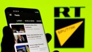 FILE PHOTO: RT app is seen on a smartphone in front of RT and Sputnik logo in this illustration taken February 28, 2022. REUTERS/Dado Ruvic/Illustration/File Photo
