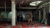 An army soldier stands amid the damages at the prayer hall after a bomb blast inside a mosque during Friday prayers in Peshawar, Pakistan, March 4, 2022. REUTERS/Fayaz Aziz