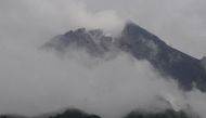 Mount Merapi volcano spews volcanic smoke as seen from Balerante following an eruption in Klaten, Central Java province, Indonesia, March 10, 2022, in this photo taken by Antara Foto. Antara Foto/Aloysius Jarot Nugroho/ via REUTERS