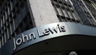 Shoppers pass a branch of John Lewis in London, Britain, September 15, 2016. REUTERS/Toby Melville/File Photo