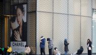 Shoppers line up outside a Chanel store in Seoul, South Korea, March 16, 2022. Picture taken March 16, 2022. REUTERS/Heo Ran