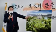 South Korea's president-elect Yoon Suk-yeol shows a bird's eye view of his planned relocation of the presidential office during a news conference, at his transition team office, in Seoul, South Korea, March 20, 2022.Jung Yeon-je/Pool via REUTERS