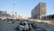 A view shows a destroyed car at the site of a shelling of a shopping center in the Podilskyi district of Kyiv, as Russia's invasion of Ukraine continues, in Kyiv, Ukraine March 21, 2022. REUTERS/Serhii Nuzhnenko
