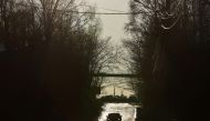 A car drives along a road in the town of Pokrov in Vladimir Region, Russia March 21, 2022. Picture taken March 21, 2022. REUTERS/Evgenia Novozhenina