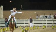 An archer in action during the second Al Nashaab Horseback Archery Championship.
