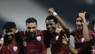 Al Wakrah players celebrate their victory.