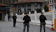 Members of the Turkish Presidential security team stand guard outside the Dolmabahce Presidential Working Office during the face-to-face talks between Ukrainian and Russian negotiators, in Istanbul, Turkey March 29, 2022. Reuters/Dilara Senkaya