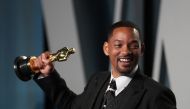 Will Smith poses with his Oscar as he arrives at the Vanity Fair Oscar party during the 94th Academy Awards in Beverly Hills, California, U.S., on March 27, 2022. Reuters/Danny Moloshok