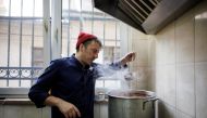 Ukrainian celebrity chef Ievgen Klopotenko checks a borscht soup in his restaurant’s kitchen, in Lviv, Ukraine, March 29, 2022. Klopotenko, who came from Kyiv to Lviv when Russia’s attack on Ukraine started, opened a restaurant where he offers free meals for refugees. REUTERS/Alkis Konstantinidis
