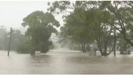 A view shows a flooded street following heavy rains in the northern town of Lismore, New South Wales, Australia March 30, 2022 in this still image taken from a video. Seven Network/Handout via REUTERS