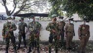 Sri Lankan Special Task Force and Police officers stand guard at the top of the road to Sri Lankan President Gotabaya Rajapaksa's residence, after police officers and demonstrators clashed at a protest against him, as many parts of the crisis-hit country faced up to 13 hours without electricity due to a shortage of foreign currency to import fuel, in Colombo, Sri Lanka April 1, 2022. REUTERS/Dinuka Liyanawatte
