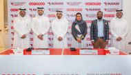 Moza Al Muhannadi, Director CSR, Sponsorship and Media, Ooredoo Qatar and Abdullah Al Marafi, Head of Programmes at Al Kass Sports Channels along with other officials pose for a group photo after the press conference at Ooredoo’s headquarters yesterday.   